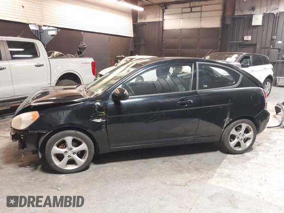 2007 Hyundai Accent SE with VIN KMHCN36C67U026540, listed as a IAAI auction lot 41062633 with 70,143 mi miles. Bid and sale history available at carsss.com. Image 15.