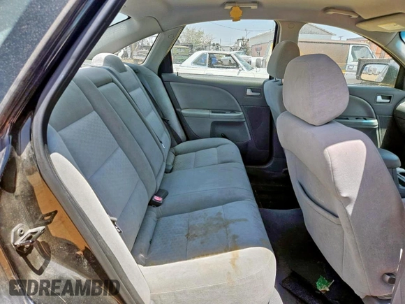 2005 Ford Five Hundred SE z VIN 1FAFP23135G155457, wystawiony jako Copart lot #59118245 z przebiegiem 157 582 mil mil oraz Tytuł czysty. Historia ofert i sprzedaży dostępna na DreamBid. Obrazek 6.