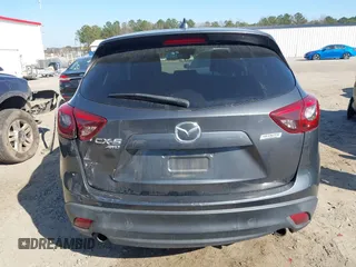 2016 Mazda CX-5 Grand Touring with VIN JM3KE4DY8G0823567, listed as a IAAI auction lot 41784384 with 143,836 mi miles and . Bid and sale history available at carsss.com. Image 16.