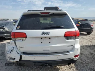 2014 Jeep Grand Cherokee Limited with VIN 1C4RJFBG4EC299273, listed as a Copart auction lot 59660695 with 162,528 mi miles and Salvage title. Bid and sale history available at DreamBid. Image 6.