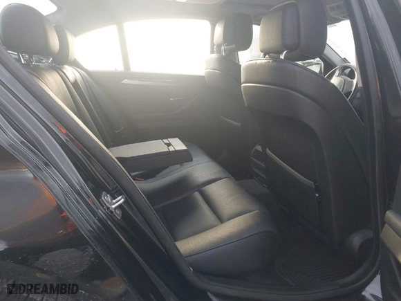 2012 BMW 5 Series 528i with VIN WBAXG5C52CDX05794, listed as a IAAI auction lot 41796084 with 104,022 mi miles. Bid and sale history available at carsss.com. Image 8.
