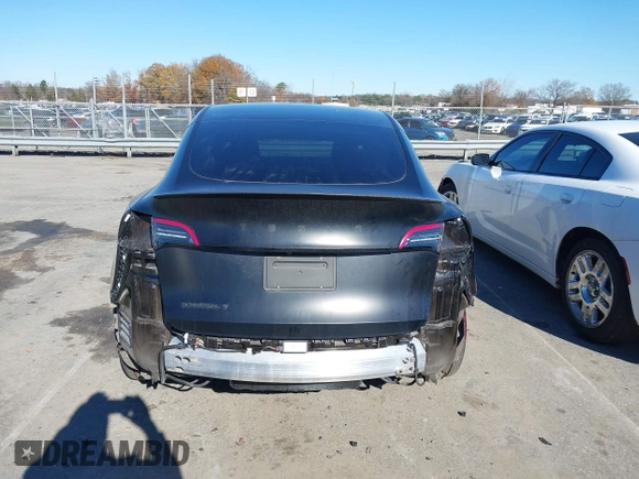 2022 Tesla Model Y Long Range with VIN 7SAYGDEEXNF424856, listed as a IAAI auction lot 41059718 with 44,439 mi miles and . Bid and sale history available at carsss.com. Image 17.