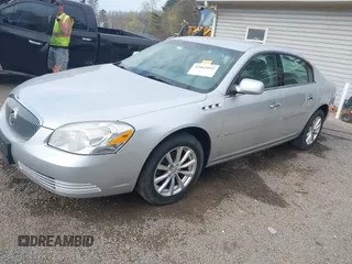 2009 Buick Lucerne CXL with VIN 1G4HD57M79U141033, listed as a IAAI auction lot 42061042 with 161,021 mi miles. Bid and sale history available at carsss.com. Image 2.