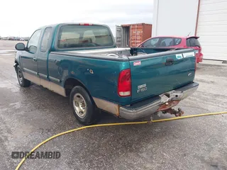 1997 Ford F-150 XL with VIN 1FTEX17LXVNC32588, listed as a IAAI auction lot 40848063 with 210,113 mi miles and . Bid and sale history available at DreamBid. Image 3.