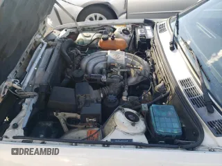 1987 BMW 3 Series z VIN WBABB2308H1941161, wystawiony jako Copart lot #73581994 z przebiegiem 143 155 mil mil oraz Szkoda całkowita • Salvage title. Historia ofert i sprzedaży dostępna na DreamBid. Obrazek 11.