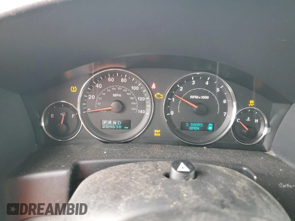 2007 Jeep Commander Sport z VIN 1J8HG48K97C598103, wystawiony jako Copart lot #65140225 z przebiegiem 204 638 mil mil oraz Czysty tytuł • Clean title. Historia ofert i sprzedaży dostępna na DreamBid. Obrazek 9.