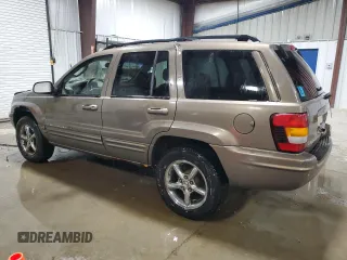2002 Jeep Grand Cherokee Limited with VIN 1J4GW58NX2C248892, listed as a Copart auction lot 55574615 with 164,010 mi miles and Salvage title. Bid and sale history available at DreamBid. Image 2.