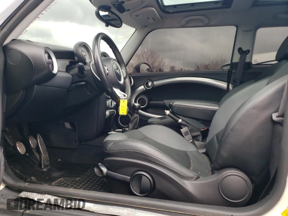 2007 MINI Hardtop S with VIN WMWMF73577TT86065, listed as a Copart auction lot 57262795 with 100,052 mi miles and Salvage Title. Bid and sale history available at DreamBid. Image 7.