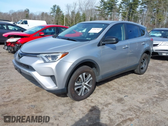 2018 Toyota RAV4 LE with VIN JTMBFREV8JJ224872, listed as a IAAI auction lot 41907962 with 104,605 mi miles and . Bid and sale history available at DreamBid. Image 2.