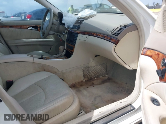 2003 Mercedes-Benz E-Class 3.2L with VIN WDBUF65J23A120318, listed as a IAAI auction lot 41927993 with 113,578 mi miles. Bid and sale history available at carsss.com. Image 5.
