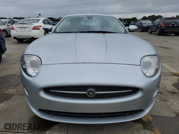 2007 Jaguar XK with VIN SAJWA43B475B12815, listed as a Copart auction lot 75012064 with 55,917 mi miles and Salvage Title. Bid and sale history available at carsss.com. Image 5.