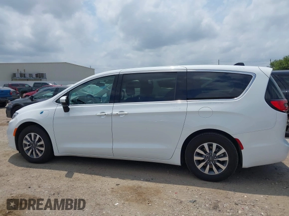 2023 Chrysler Pacifica Hybrid Touring L z VIN 2C4RC1L76PR618422, wystawiony jako IAAI lot #42289283 z przebiegiem 40 744 mil mil oraz . Historia ofert i sprzedaży dostępna na DreamBid. Obrazek 14.