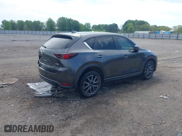 2018 Mazda CX-5 Touring with VIN JM3KFACM9J1348054, listed as a IAAI auction lot 42043458 with 120,177 mi miles. Bid and sale history available at carsss.com. Image 4.