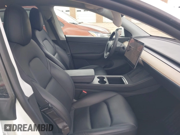 2021 Tesla Model Y Long Range with VIN 5YJYGDEE7MF198867, listed as a IAAI auction lot 42117463 with 79,759 mi miles and . Bid and sale history available at DreamBid. Image 5.