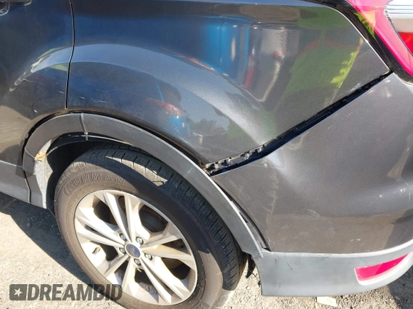 2017 Ford Escape SE z VIN 1FMCU0GDXHUB66813, wystawiony jako IAAI lot #42056150 z przebiegiem 86 915 mil mil oraz . Historia ofert i sprzedaży dostępna na DreamBid. Obrazek 18.