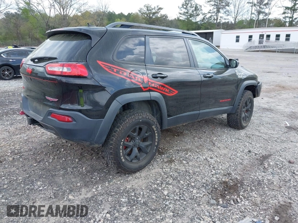 2015 Jeep Cherokee Trailhawk with VIN 1C4PJMBS5FW792184, listed as a IAAI auction lot 41827106 with 132,752 mi miles. Bid and sale history available at carsss.com. Image 4.