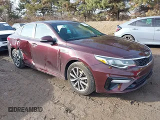 2019 Kia Optima LX z VIN 5XXGT4L30KG356534, wystawiony jako IAAI lot #41491700 z przebiegiem 66 743 mil mil oraz . Historia ofert i sprzedaży dostępna na DreamBid. Obrazek 1.