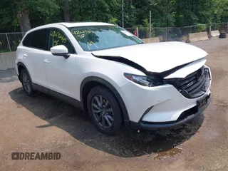 2021 Mazda CX-9 Touring with VIN JM3TCBCY2M0539878, listed as a IAAI auction lot 42476445 with 40,783 mi miles and . Bid and sale history available at DreamBid. Image 1.
