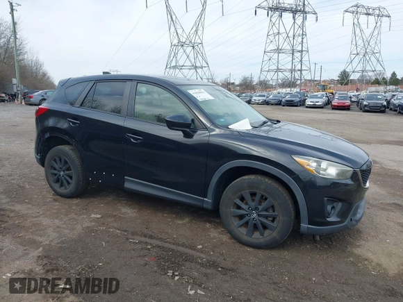 2015 Mazda CX-5 Touring with VIN JM3KE4CY2F0445178, listed as a IAAI auction lot 41828953 with 137,330 mi miles and . Bid and sale history available at DreamBid. Image 1.