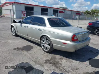 2009 Jaguar XJ with VIN SAJWA94C49TH30042, listed as a IAAI auction lot 41898085 with 145,832 mi miles and . Bid and sale history available at DreamBid. Image 3.