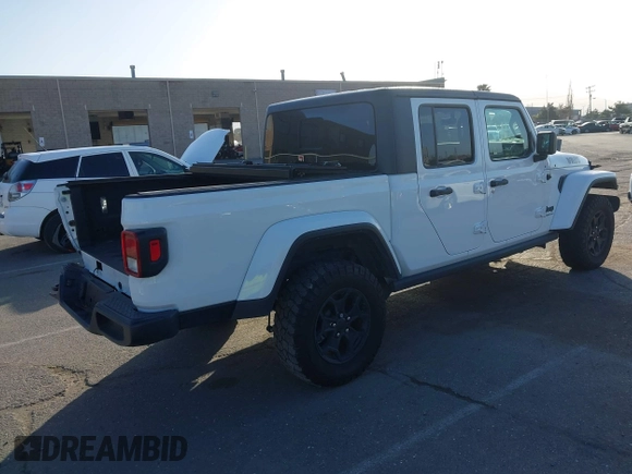2022 Jeep Gladiator Texas Trail with VIN 1C6HJTAG4NL149537, listed as a IAAI auction lot 41947122 with 43,938 mi miles. Bid and sale history available at carsss.com. Image 4.