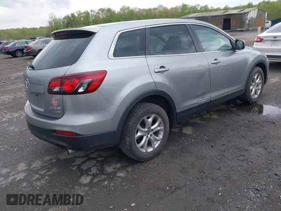 2015 Mazda CX-9 Sport with VIN JM3TB3BV2F0454770, listed as a IAAI auction lot 42009879 with 98,916 mi miles and . Bid and sale history available at carsss.com. Image 4.