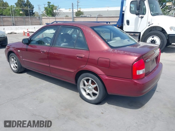 2002 Mazda Protege DX with VIN JM1BJ225621608984, listed as a IAAI auction lot 42106167 with 158,662 mi miles and . Bid and sale history available at DreamBid. Image 3.