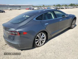 2014 Tesla Model S 60 с VIN 5YJSA1H15EFP49412, выставлен на аукционе Copart как лот 60476835 с пробегом 96 202 миль миль и Списание • Salvage title. История ставок и продаж доступна на DreamBid. Изображение 3.