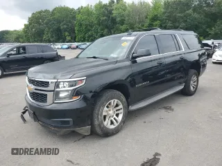 2015 Chevrolet Suburban LT with VIN 1GNSKJKC6FR527889, listed as a Copart auction lot 64877775 with 215,633 mi miles and Salvage title. Bid and sale history available at DreamBid. Image 1.