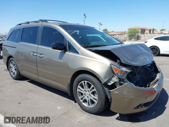 2012 Honda Odyssey EX-L z VIN 5FNRL5H63CB033049, wystawiony jako IAAI lot #42260501 z przebiegiem 165 693 mil mil oraz . Historia ofert i sprzedaży dostępna na DreamBid. Obrazek 1.