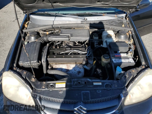 2006 Suzuki Forenza z VIN KL5JD56ZX6K278029, wystawiony jako Copart lot #82026904 z przebiegiem 117 700 mil mil oraz Szkoda całkowita • Salvage title. Historia ofert i sprzedaży dostępna na DreamBid. Obrazek 11.