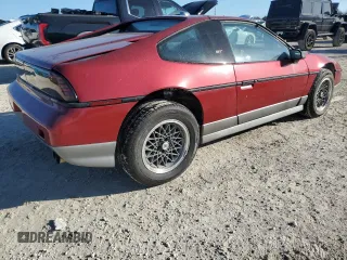 1987 Pontiac Fiero GT z VIN 1G2PG1195HP233666, wystawiony jako Copart lot #78981714 z przebiegiem Nie podano mil oraz Szkody całkowita. Historia ofert i sprzedaży dostępna na DreamBid. Obrazek 3.