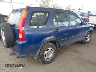 2004 Honda CR-V LX with VIN JHLRD684X4C023539, listed as a IAAI auction lot 42032809 with 186,056 mi miles and . Bid and sale history available at carsss.com. Image 4.