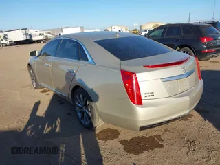 2014 Cadillac XTS with VIN 2G61L5S30E9207777, listed as a IAAI auction lot 41202654 with 112,565 mi miles. Bid and sale history available at carsss.com. Image 3.