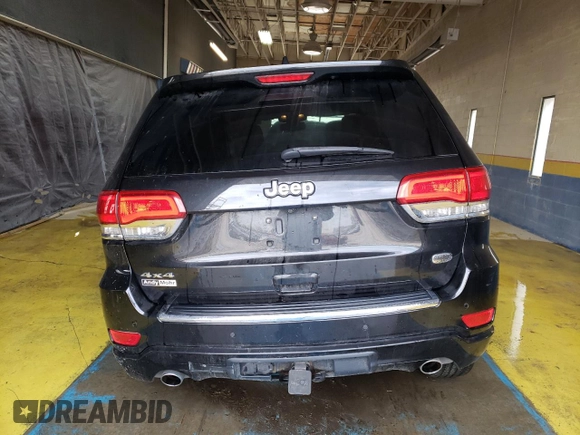 2015 Jeep Grand Cherokee Overland with VIN 1C4RJFCG8FC653117, listed as a Copart auction lot 49254595 with 142,359 mi miles and Clean Title. Bid and sale history available at carsss.com. Image 6.