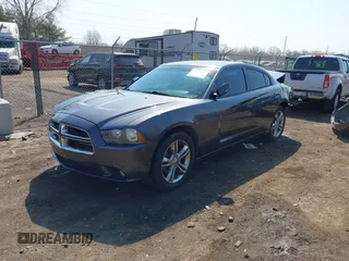 2014 Dodge Charger SXT Plus with VIN 2C3CDXJG0EH104680, listed as a IAAI auction lot 41784303 with 135,771 mi miles. Bid and sale history available at carsss.com. Image 2.