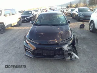 2021 Toyota Corolla SE with VIN 5YFS4MCE9MP090031, listed as a IAAI auction lot 41335232 with 57,128 mi miles. Bid and sale history available at carsss.com. Image 12.