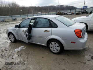2006 Suzuki Forenza z VIN KL5JD56Z46K374920, wystawiony jako Copart lot #86255044 z przebiegiem 58 669 mil mil oraz Szkoda całkowita • Salvage title. Historia ofert i sprzedaży dostępna na DreamBid. Obrazek 2.