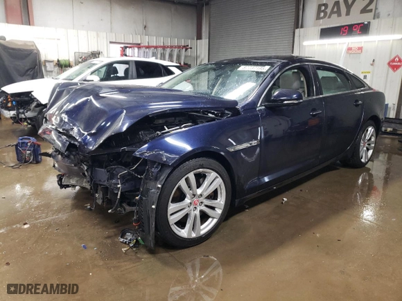 2014 Jaguar XJ with VIN SAJWJ2GD5E8V69562, listed as a Copart auction lot 87737195 with 100,525 mi miles and Salvage Title. Bid and sale history available at carsss.com. Image 1.