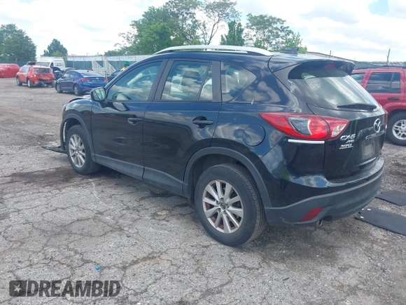 2016 Mazda CX-5 Sport with VIN JM3KE4BY2G0796577, listed as a IAAI auction lot 42230645 with 103,223 mi miles and . Bid and sale history available at DreamBid. Image 3.