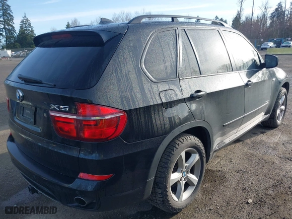 2011 BMW X5 35i with VIN 5UXZV4C57BL408907, listed as a IAAI auction lot 41807017 with 162,710 mi miles. Bid and sale history available at carsss.com. Image 4.