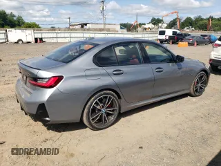 2023 BMW 3 Series 330e xDrive with VIN 3MW39FS02P8D01319, listed as a Copart auction lot 67836734 with 12,883 mi miles and Salvage Title. Bid and sale history available at carsss.com. Image 3.