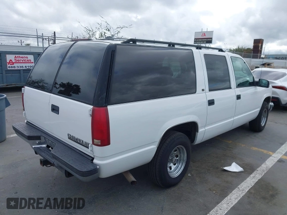 1999 Chevrolet Suburban with VIN 3GNEC16R2XG247140, listed as a IAAI auction lot 41761237 with 202,121 mi miles. Bid and sale history available at carsss.com. Image 4.