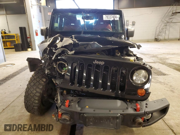 2013 Jeep Wrangler Rubicon with VIN 1C4HJWCG6DL666540, listed as a Copart auction lot 79337404 with 130,448 mi miles and Salvage title. Bid and sale history available at DreamBid. Image 5.