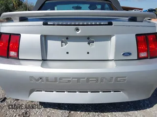2003 Ford Mustang Deluxe z VIN 1FAFP44453F379157, wystawiony jako IAAI lot #41612382 z przebiegiem 107 599 mil mil oraz . Historia ofert i sprzedaży dostępna na DreamBid. Obrazek 6.