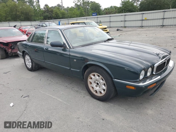 1999 Jaguar XJ with VIN SAJHX1044XC865054, listed as a Copart auction lot 57825325 with 71,145 mi miles and Clean title. Bid and sale history available at DreamBid. Image 4.