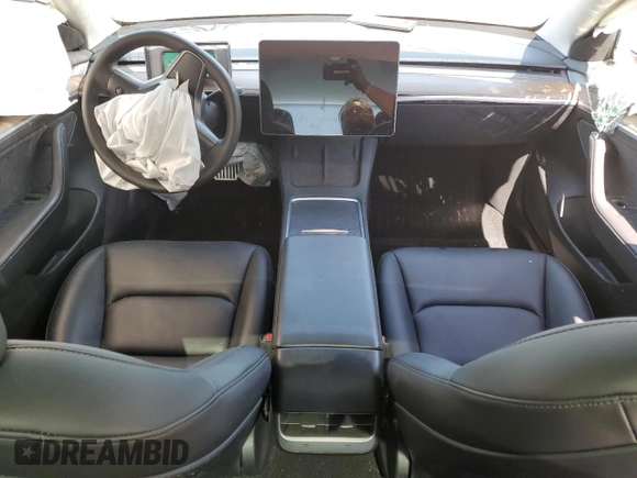 2023 Tesla Model 3 with VIN 5YJ3E1EA9PF558088, listed as a Copart auction lot 52228465 with 63,204 mi miles and Salvage title. Bid and sale history available at DreamBid. Image 8.