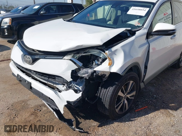 2017 Toyota RAV4 XLE with VIN JTMWFREV9HJ128521, listed as a IAAI auction lot 41658054 with 106,788 mi miles and . Bid and sale history available at DreamBid. Image 6.