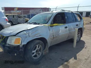 2004 GMC Envoy SLT with VIN 1GKDT13S742133932, listed as a IAAI auction lot 41598339 with 168,651 mi miles and . Bid and sale history available at DreamBid. Image 2.