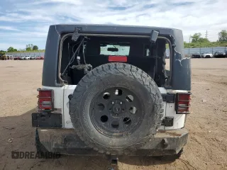 2016 Jeep Wrangler Willys Wheeler z VIN 1C4AJWAG4GL243285, wystawiony jako Copart lot #58035425 z przebiegiem 100 251 mil mil oraz Szkoda całkowita • Salvage title. Historia ofert i sprzedaży dostępna na DreamBid. Obrazek 6.